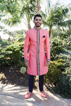 Indian groom's black and coral sangeet fashion. Indian groom's black and coral sangeet fashion.
