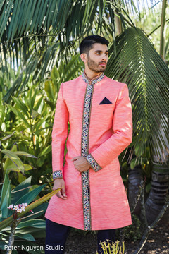 Indian groom on his coral and floral sherwani. Indian groom on his coral and floral sherwani.