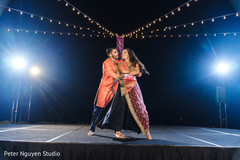 Indian bride and groom dancing at sangeet stage. Indian bride and groom dancing at sangeet stage.