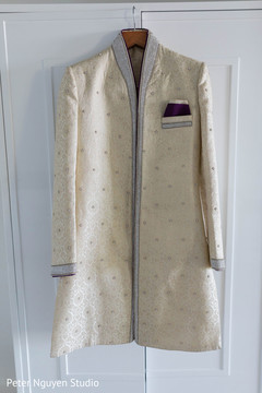 Indian groom's ivory, silver and purple sherwani. Indian groom's ivory, silver and purple sherwani.