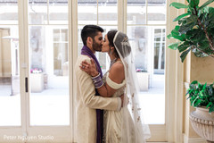 Indian groom kissing the bride capture. Indian groom kissing the bride capture.