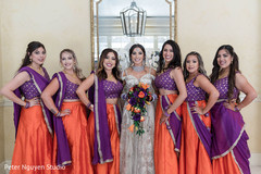 Sweet indian bride with bridesmaids posing for photo shoot. Sweet indian bride with bridesmaids posing for photo shoot.