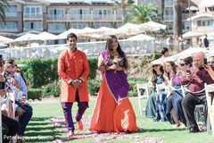 Indian bridesmaid and groomsmen on their coral and purple outfits. Indian bridesmaid and groomsmen on their coral and purple outfits.