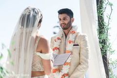 Indian groom admiring bride during the vows. Indian groom admiring bride during the vows.