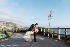 Indian bride and groom posing outdoors on reception outfits. Indian bride and groom posing outdoors on reception outfits.