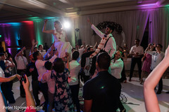 Gleeful indian wedding reception dance. Gleeful indian wedding reception dance.