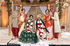 Indian couple with relatives at ceremony mandap capture. Indian couple with relatives at ceremony mandap capture.