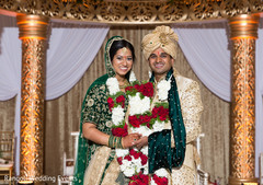 Indian couple posing at ceremony mandap. Indian couple posing at ceremony mandap.