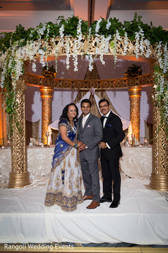 Indian groom posing with relatives at reception venue. Indian groom posing with relatives at reception venue.