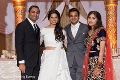 Indian couple next to siblings photo session. Indian couple next to siblings photo session.