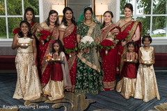 Indian bridesmaids and flowergirls posing with maharani. Indian bridesmaids and flowergirls posing with maharani.