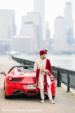 Indian groom posing on his Ferrari Indian groom posing on his Ferrari