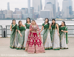 Indian bride posing with bridesmaids on ceremony outfits. Indian bride posing with bridesmaids on ceremony outfits.