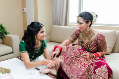Maharani getting her anklets on . Maharani getting her anklets on .