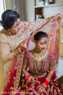 Maharani getting her red and golden ghoonghat. Maharani getting her red and golden ghoonghat.