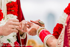 Indian bride putting ring to groom ritual. Indian bride putting ring to groom ritual.
