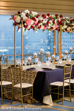 Indian wedding rectangle table Golden centerpiece flowers decoration. Indian wedding rectangle table Golden centerpiece flowers decoration.