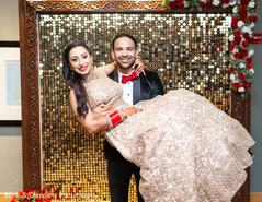 Indian couple posing for reception photo session. Indian couple posing for reception photo session.