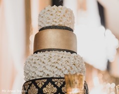 Indian wedding golden black and white reception cake decor. Indian wedding golden black and white reception cake decor.