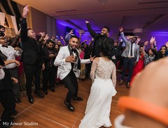 Indian couple dancing with guests. Indian couple dancing with guests.