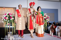Indian groom entering the ceremony with his family. Indian groom entering the ceremony with his family.