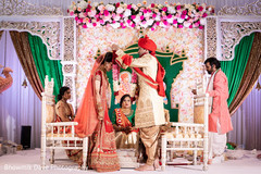 Indian Groom putting flowers garland to his Bride. Indian Groom putting flowers garland to his Bride.