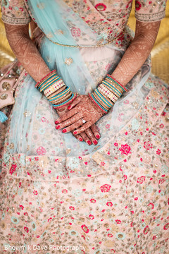 Fantastic Indian Bride posing her Mehndi art and bracelets. Fantastic Indian Bride posing her Mehndi art and bracelets.
