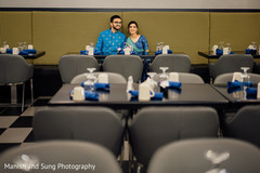Indian couple sitting in a table at the cafeteria Indian couple sitting in a table at the cafeteria