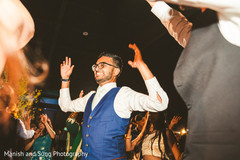 Indian groom dancing during the reception Indian groom dancing during the reception