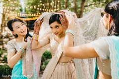 Indian bride getting her ghoonghat veil on. Indian bride getting her ghoonghat veil on.