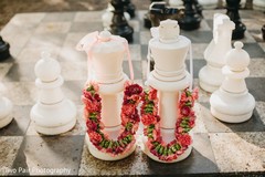 Indian wedding garlands capture on big chess decoration. Indian wedding garlands capture on big chess decoration.