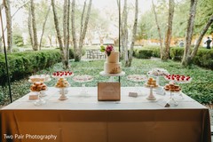 Indian wedding cake table setup outdoors. Indian wedding cake table setup outdoors.
