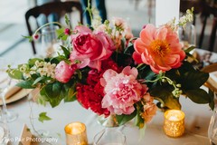 Indian wedding table peach and pink flowers centerpiece decorations. Indian wedding table peach and pink flowers centerpiece decorations.