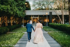 Indian couple walking into wedding reception. Indian couple walking into wedding reception.
