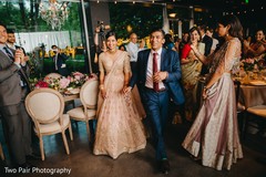 Indian couple making their entrance to reception party. Indian couple making their entrance to reception party.