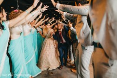 Upbeat Indian couple entrance to reception. Upbeat Indian couple entrance to reception.