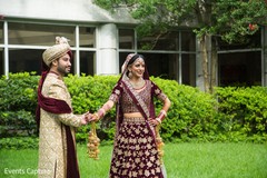 Indian bride and groom holding hands at first look photography. Indian bride and groom holding hands at first look photography.