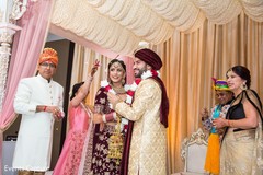 Indian couple exchanging the garlands ritual. Indian couple exchanging the garlands ritual.