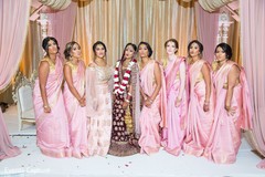 Indian bride with bridesmaids posing on their ceremony sarees. Indian bride with bridesmaids posing on their ceremony sarees.