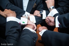 Indian groomsmen showing their heroes Cufflinks. Indian groomsmen showing their heroes Cufflinks.