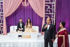 Indian relatives giving out speech at wedding reception. Indian relatives giving out speech at wedding reception.