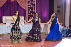 indian bridesmaids performing a dance at reception. indian bridesmaids performing a dance at reception.