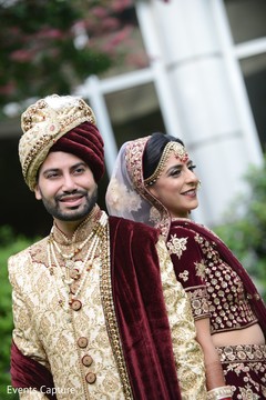 Indian couple on their golden and red belbet ceremony outfits. Indian couple on their golden and red belbet ceremony outfits.