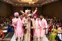 Raja posing with groomsmen on wedding ceremony aisle. Raja posing with groomsmen on wedding ceremony aisle.