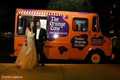Indian couple posing next to Ice Cream truck. Indian couple posing next to Ice Cream truck.