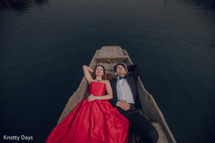 Indian couple posing on a boat capture. Indian couple posing on a boat capture.