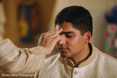 Indian groom receiving a blessing Indian groom receiving a blessing