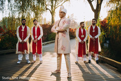 Indian groom posing in front of his Indian groomsmen Indian groom posing in front of his Indian groomsmen