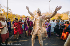 Indian groom dancing during the Baraat Indian groom dancing during the Baraat