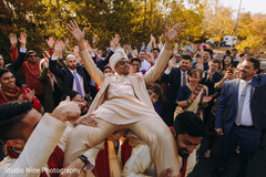 Indian groom being carried by his Indian groomsmen Indian groom being carried by his Indian groomsmen